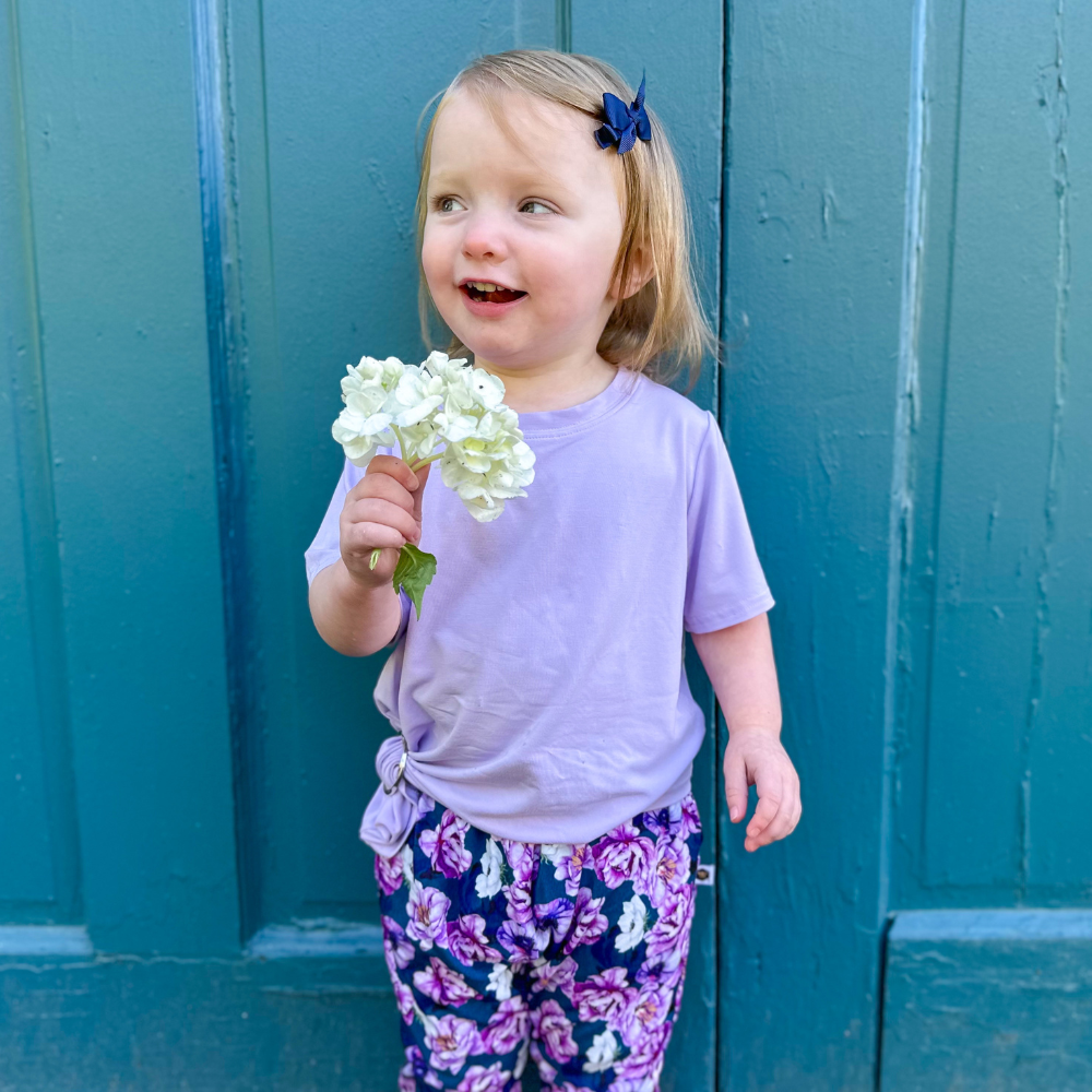 Toddler in bumblito bamboo crew-neck tee, lifestyle shot with soft natural light