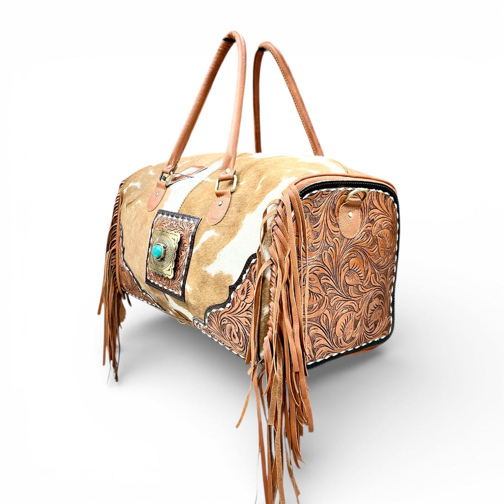 TAN TOOLED LEATHER & COWHIDE DUFFLE BAG