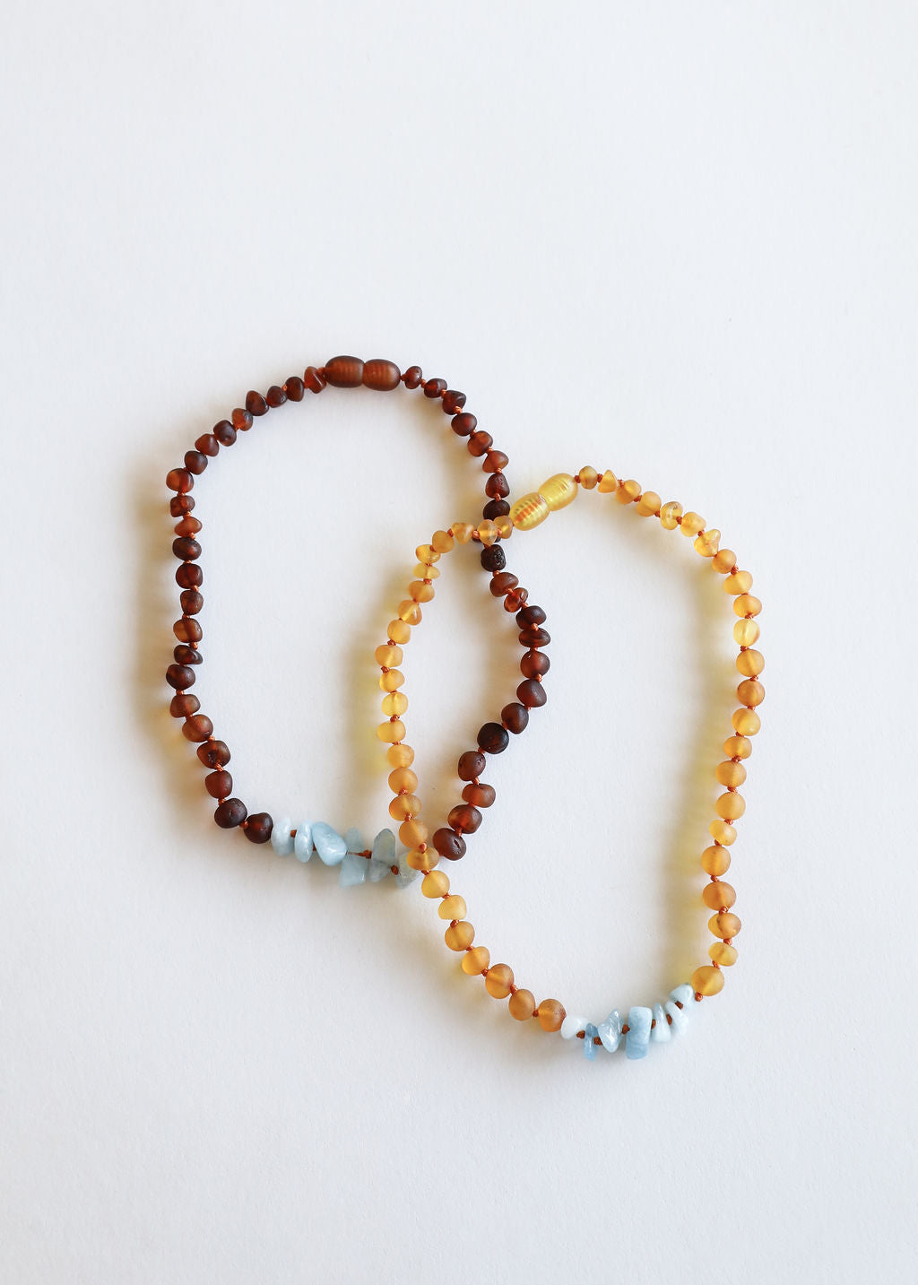 CanyonLeaf Raw Cognac Baltic Amber + Aquamarine || Necklace — CanyonLeaf branding close-up