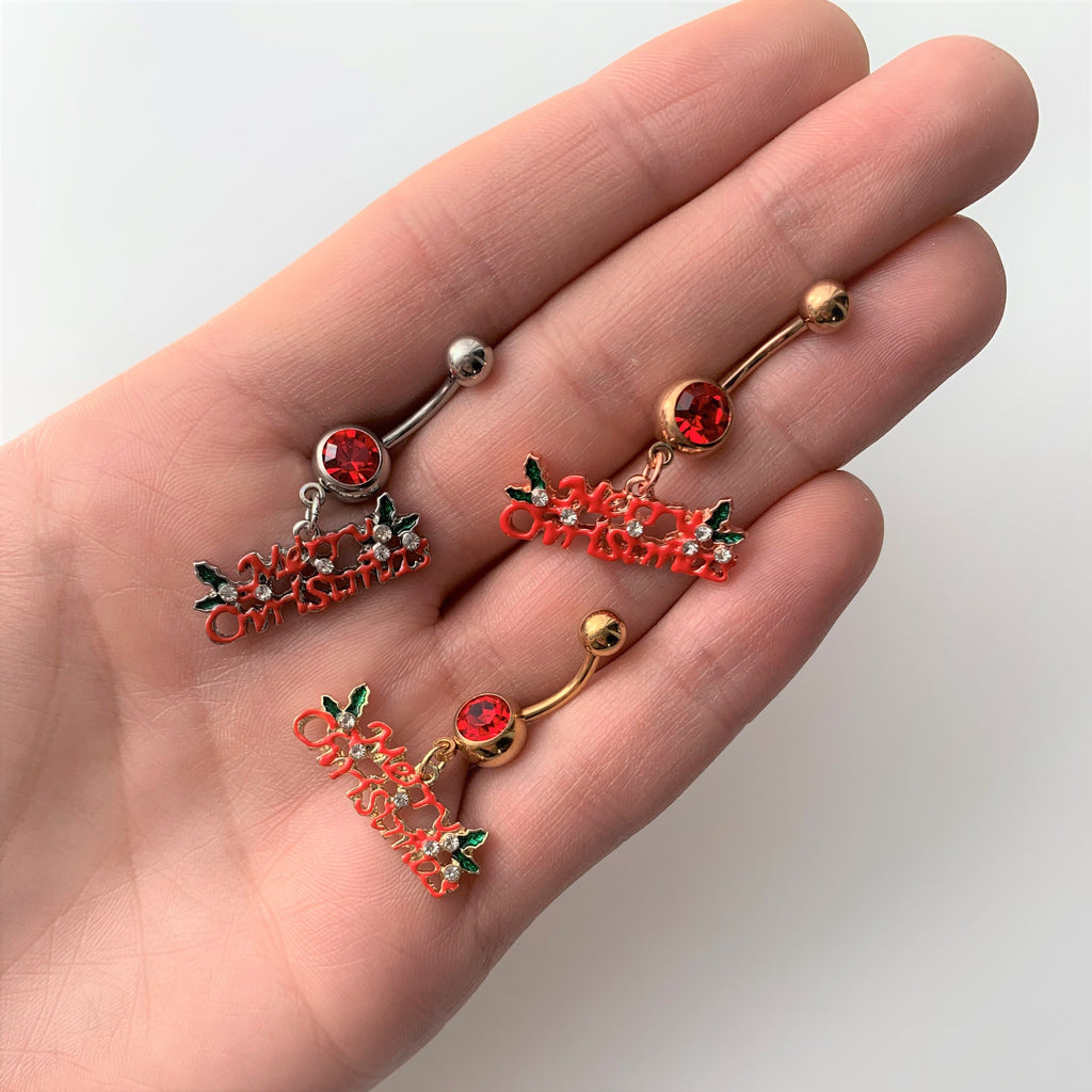 BodyCandy Red Gem Gold Tone Merry Christmas Dangle Belly Ring — detail close-up