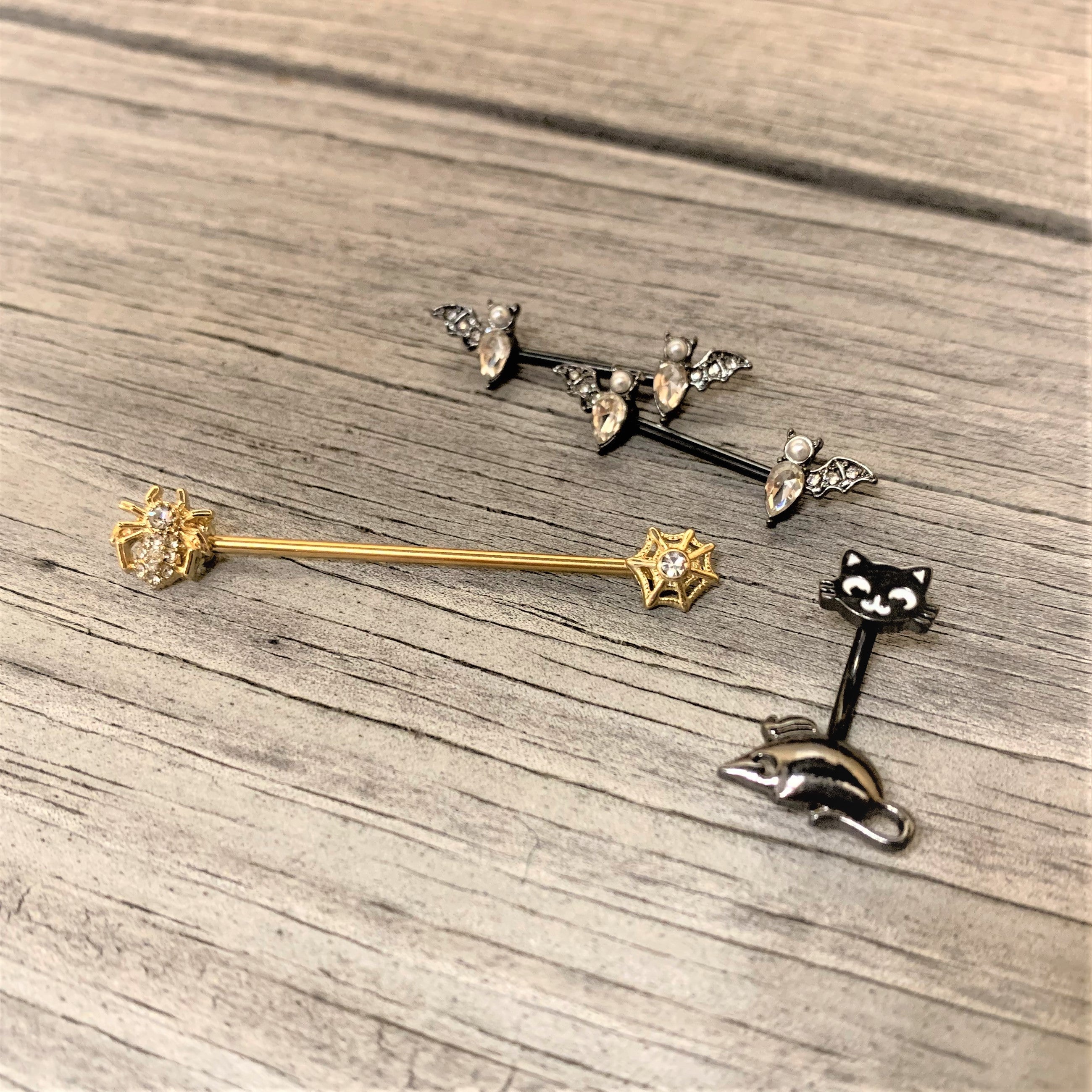 BodyCandy 14G 9/16 Clear Gem Black Bat Halloween Barbell Nipple Ring Set — detail close-up