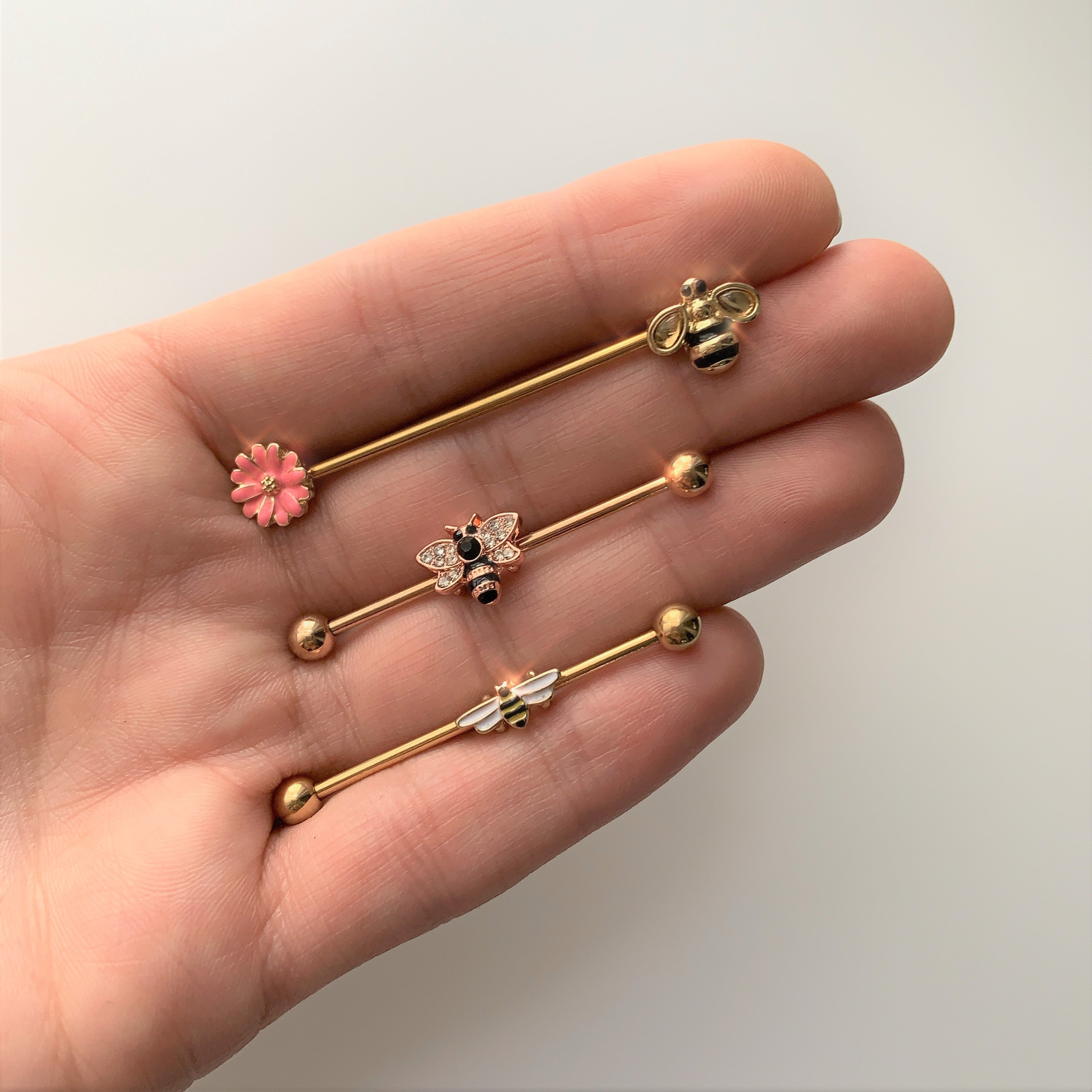 BodyCandy 14G Clear Black Gem Rose Gold Tone Bee Industrial Barbell 38mm — detail close-up