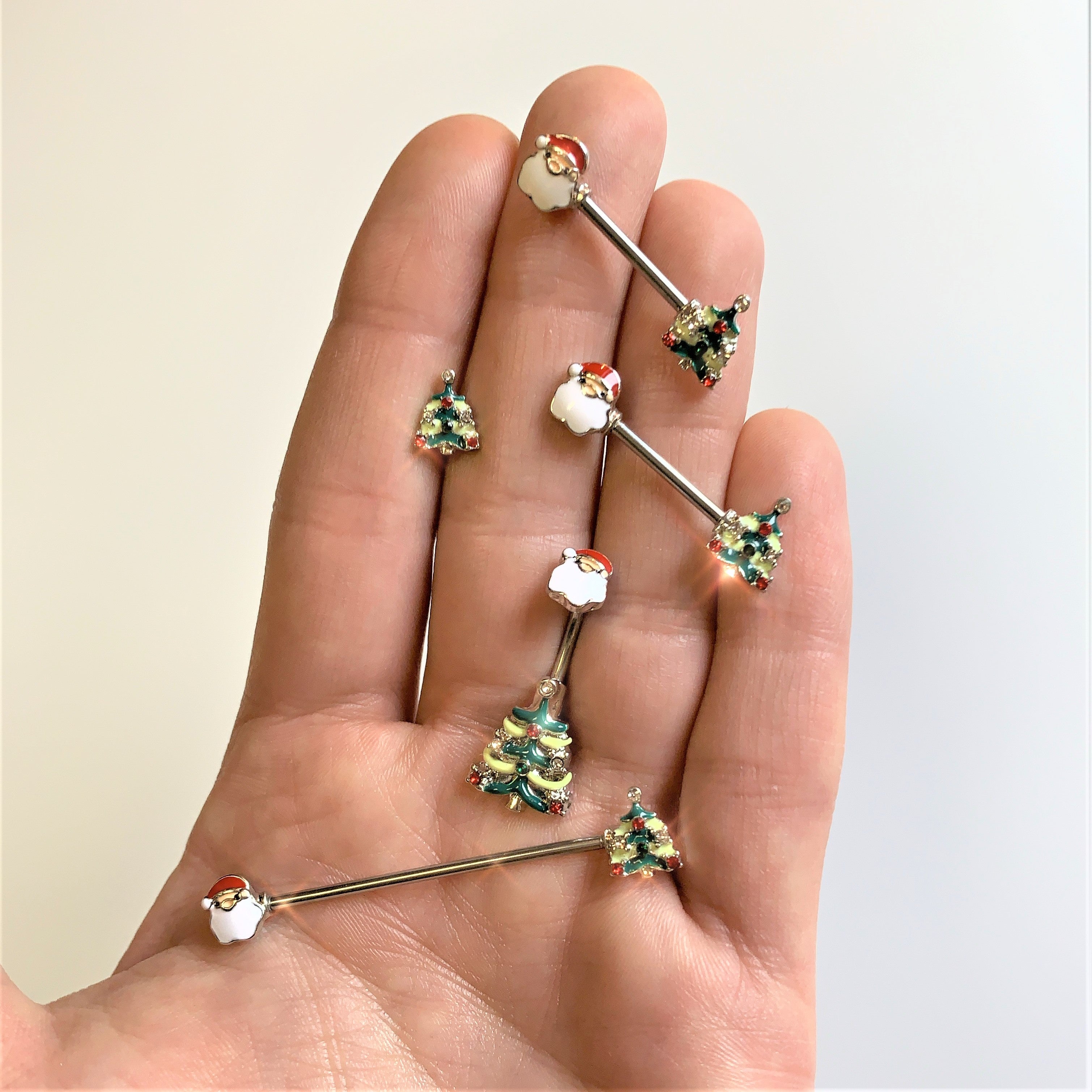 BodyCandy 14G 9/16 Red Gem Santa Christmas Tree Barbell Nipple Ring Set — detail close-up