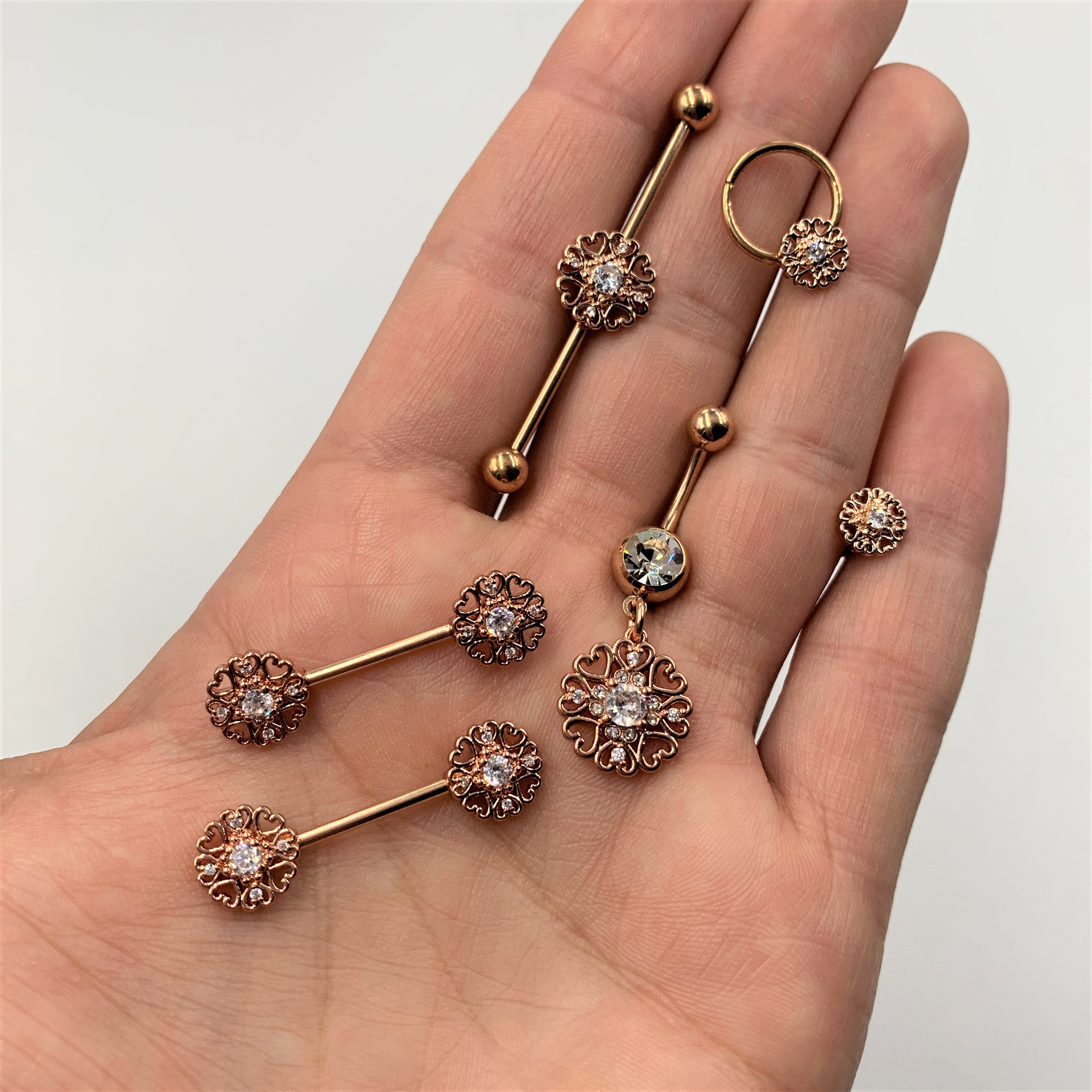 BodyCandy 14G Clear CZ Gem Rose Gold Tone Hearts Industrial Barbell 38mm — detail close-up