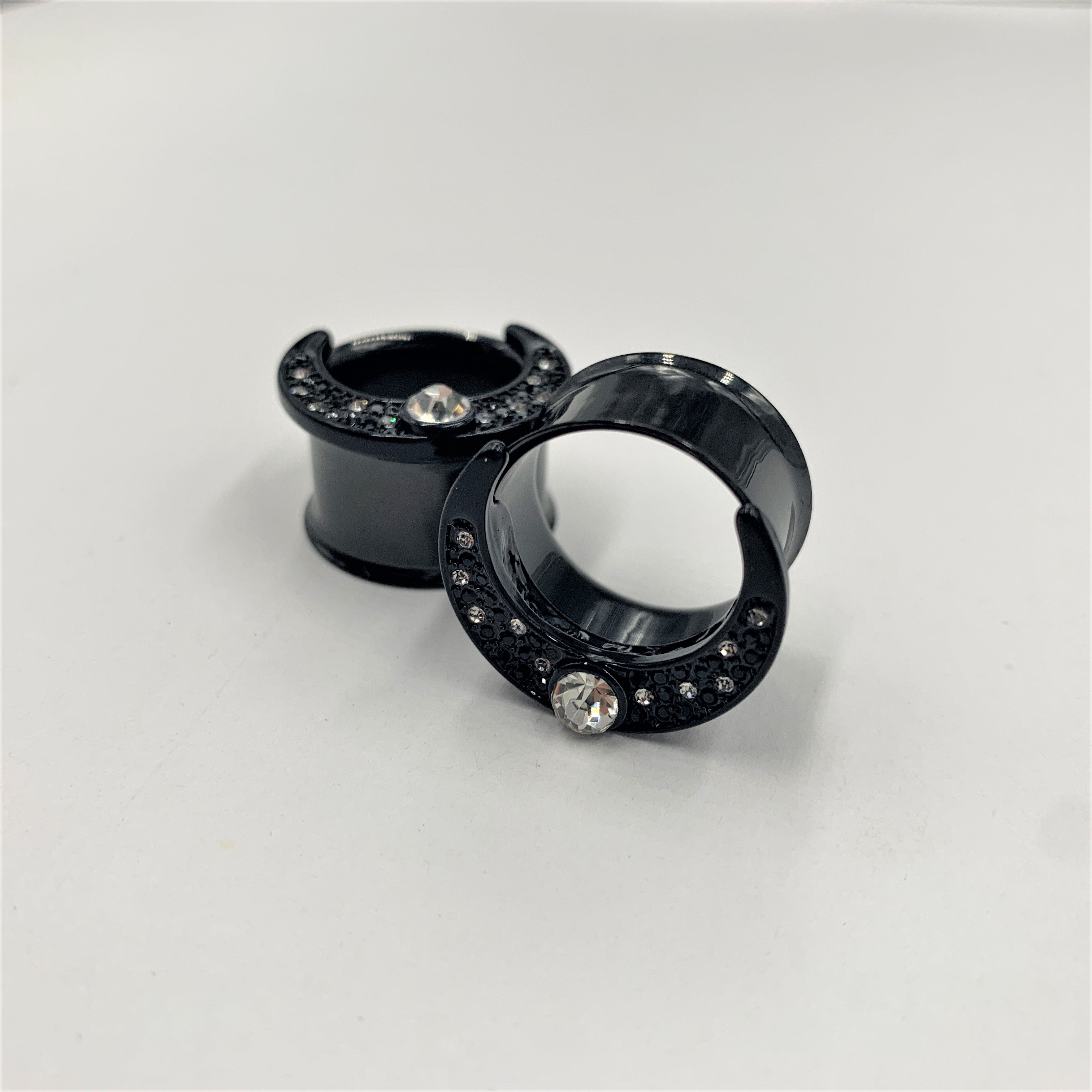 BodyCandy Clear Gem Black Crescent Moon Double Flare Tunnel Plug Set — lifestyle context