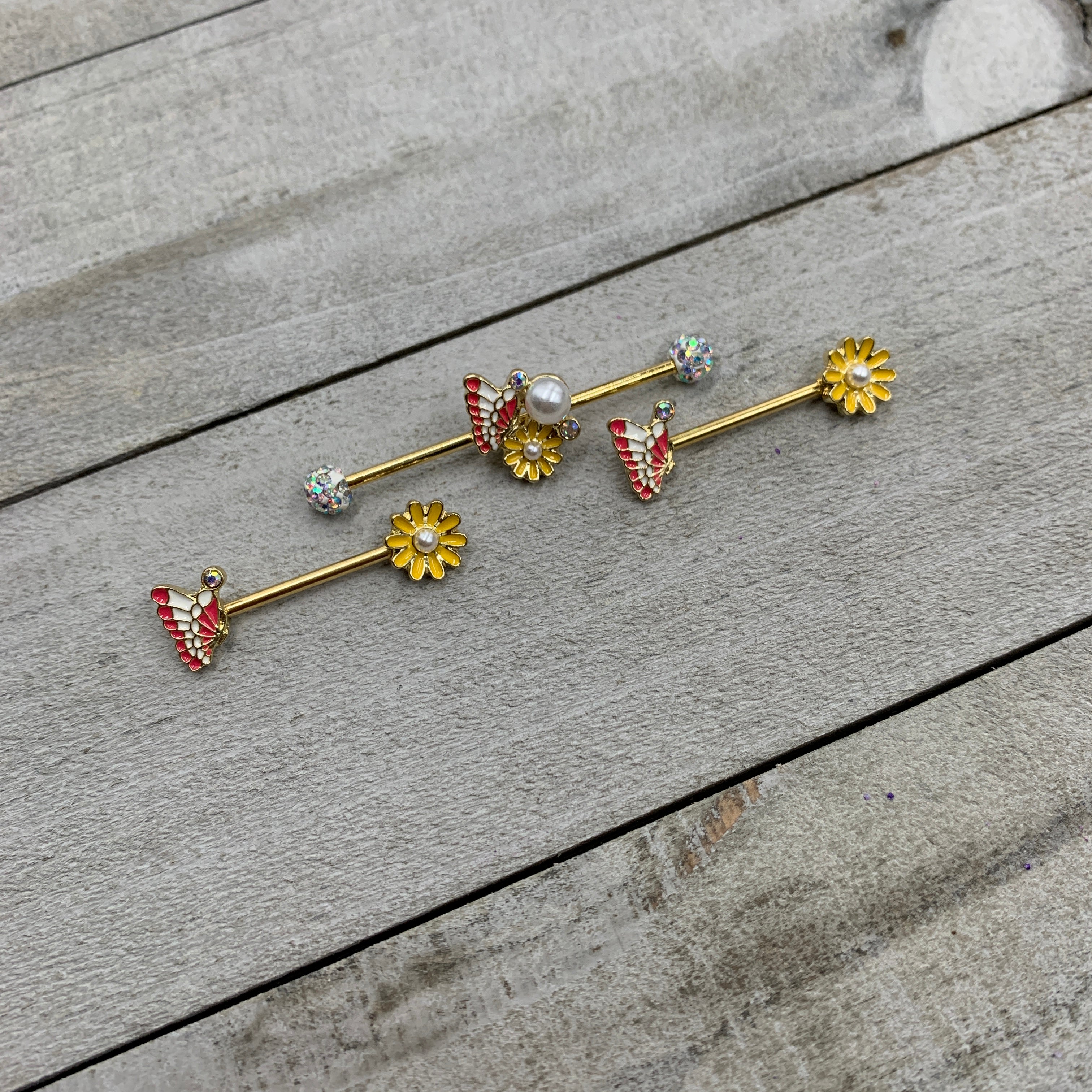 BodyCandy 14G 5/8 Aurora Gem Gold Tone Butterfly Flower Barbell Nipple Ring Set — lifestyle context