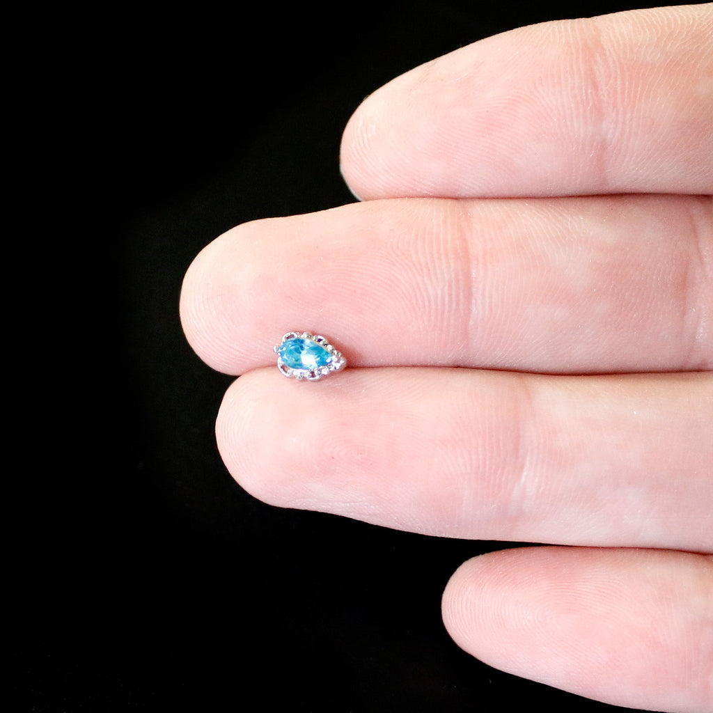 BodyCandy 20G 1/4 Blue Gem Textured Art Deco Nose Bone — in-use photo