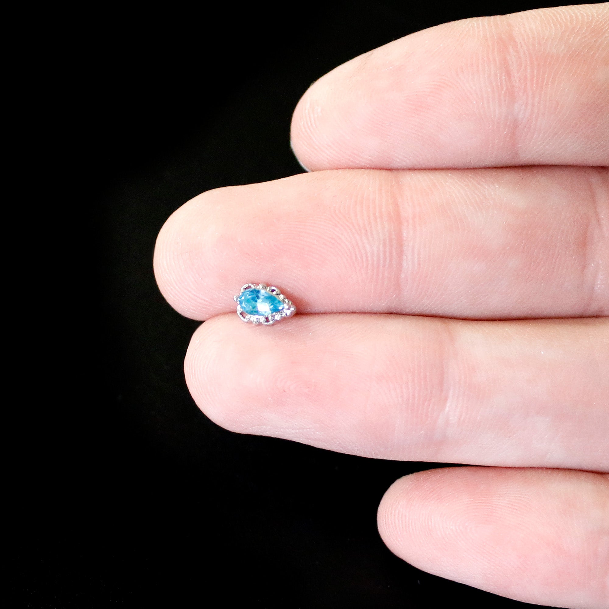 BodyCandy 20G 1/4 Blue Gem Textured Art Deco Nose Bone — in-use photo