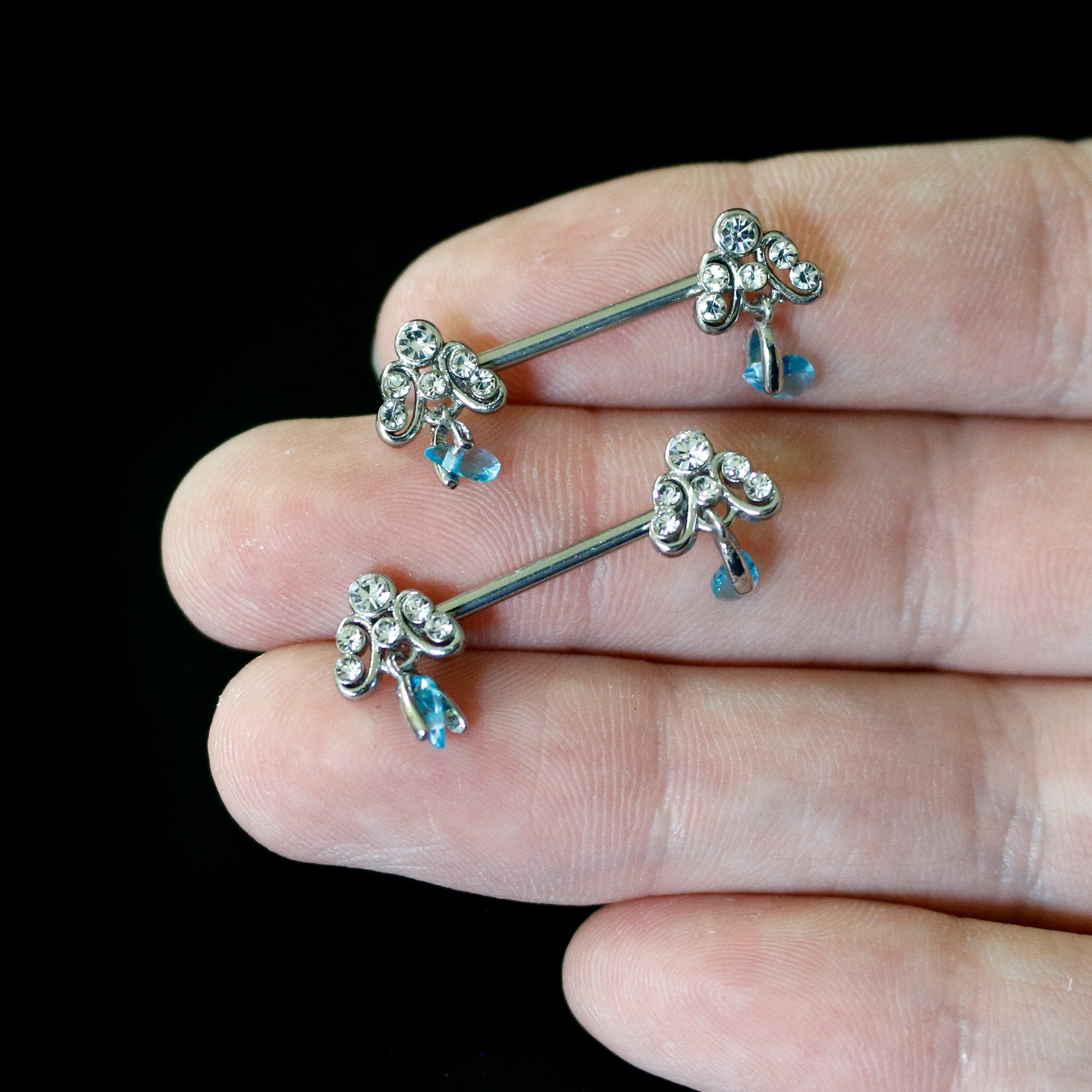 BodyCandy 14G 9/16 Blue Gem Scrolling Elegance Dangle Nipple Ring Set — back view