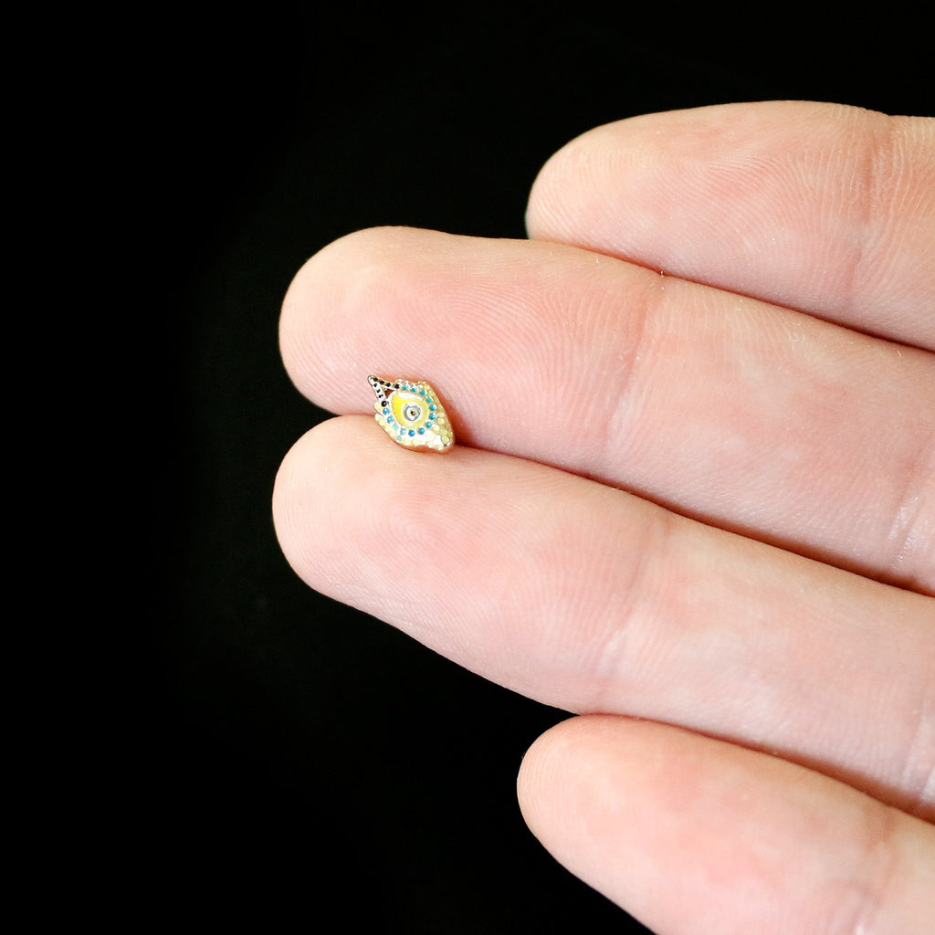 BodyCandy 16G 1/4 Gold Tone Bold Peacock Feather Labret Monroe Tragus — in-use photo
