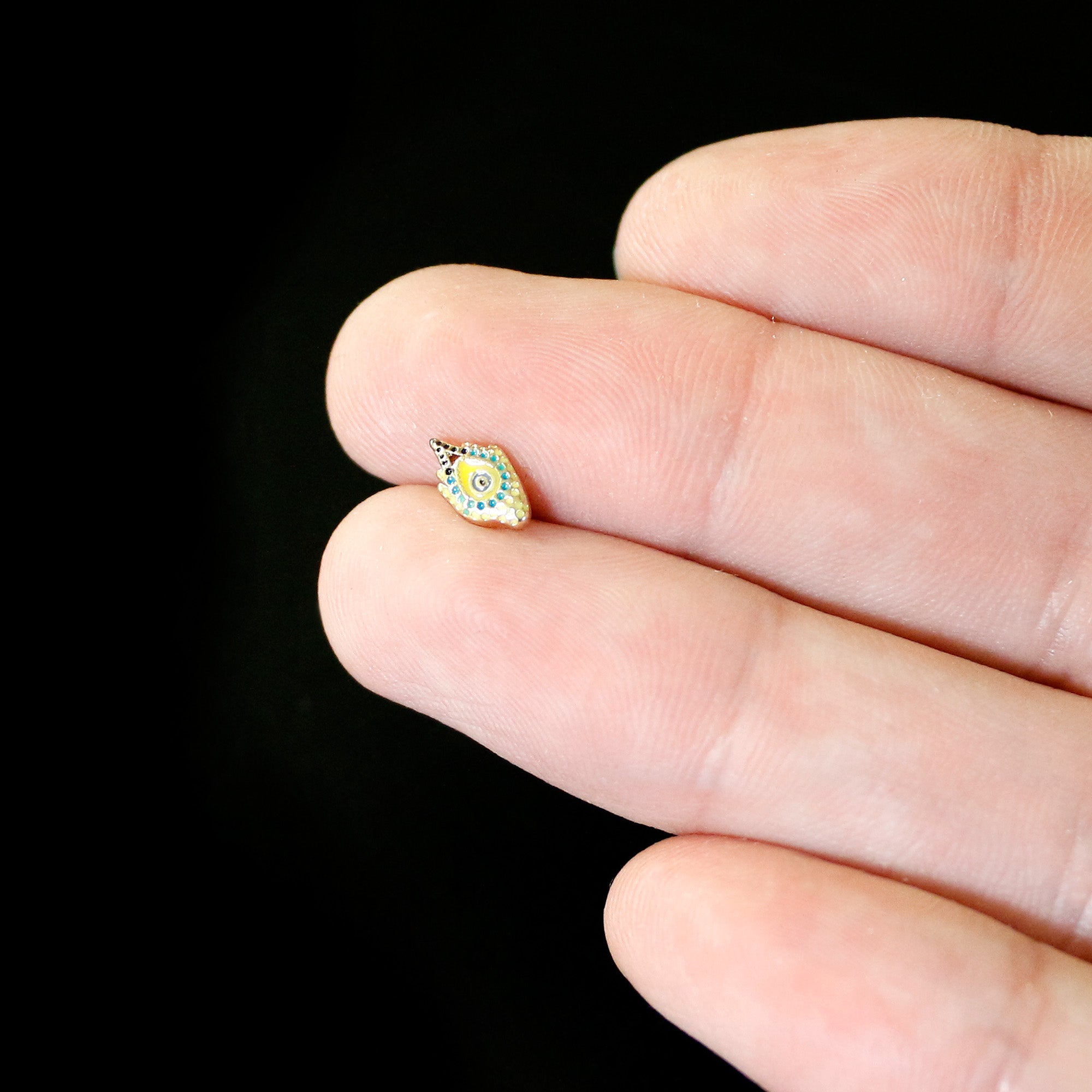 BodyCandy 16G 1/4 Gold Tone Bold Peacock Feather Labret Monroe Tragus — in-use photo