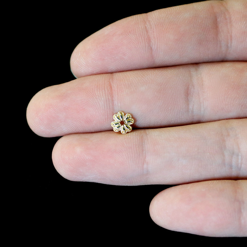 BodyCandy 16G 1/4 Yellow Gem Gold Tone Textured Cross Labret — in-use photo