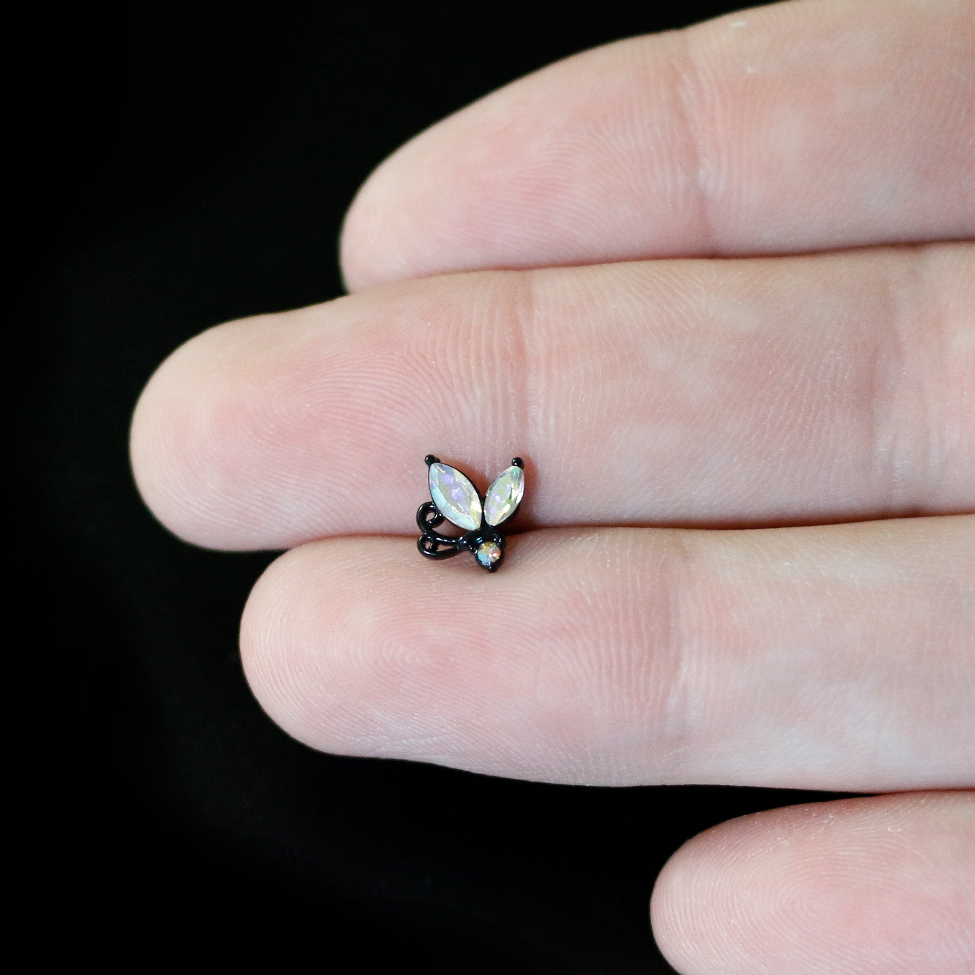 BodyCandy 16G 1/4 Aurora CZ Gem Black Fleur de Lis Butterfly Cartilage Tragus Earring — in-use photo