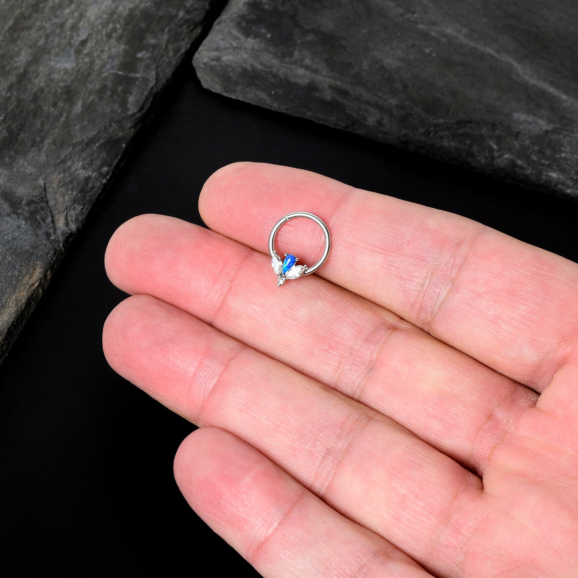 BodyCandy 16G 3/8 Blue Faux Opal Style Flower Hinged Segment Ring — in-use photo