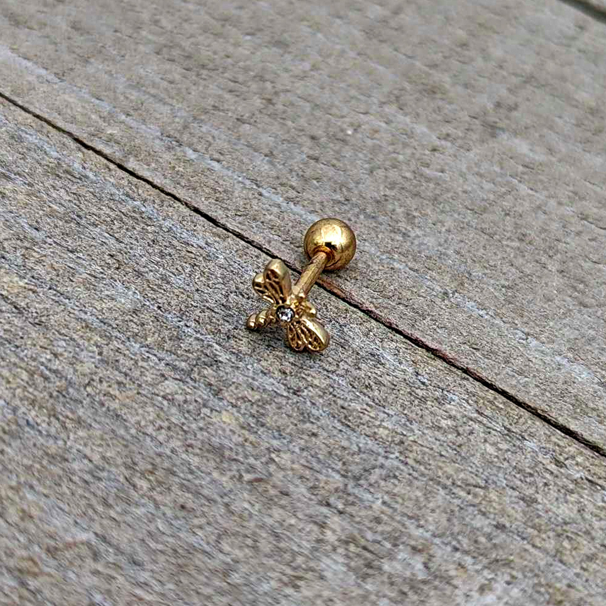 BodyCandy 16G 1/4 Clear Gem Gold Tone Flying Dragonfly Cartilage Earring — in-use photo