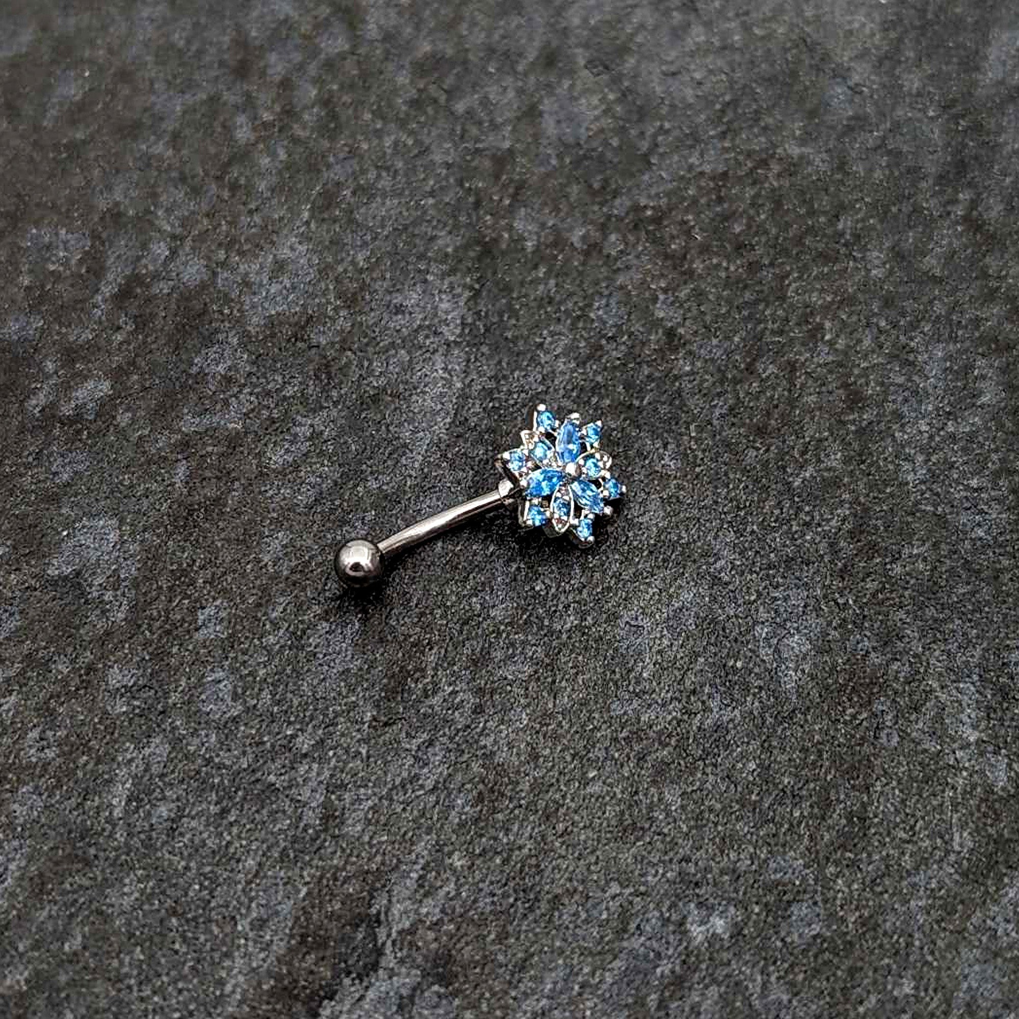 BodyCandy 16G 5/16 Blue CZ Gem Snowflake Blues Curved Eyebrow Ring — side view