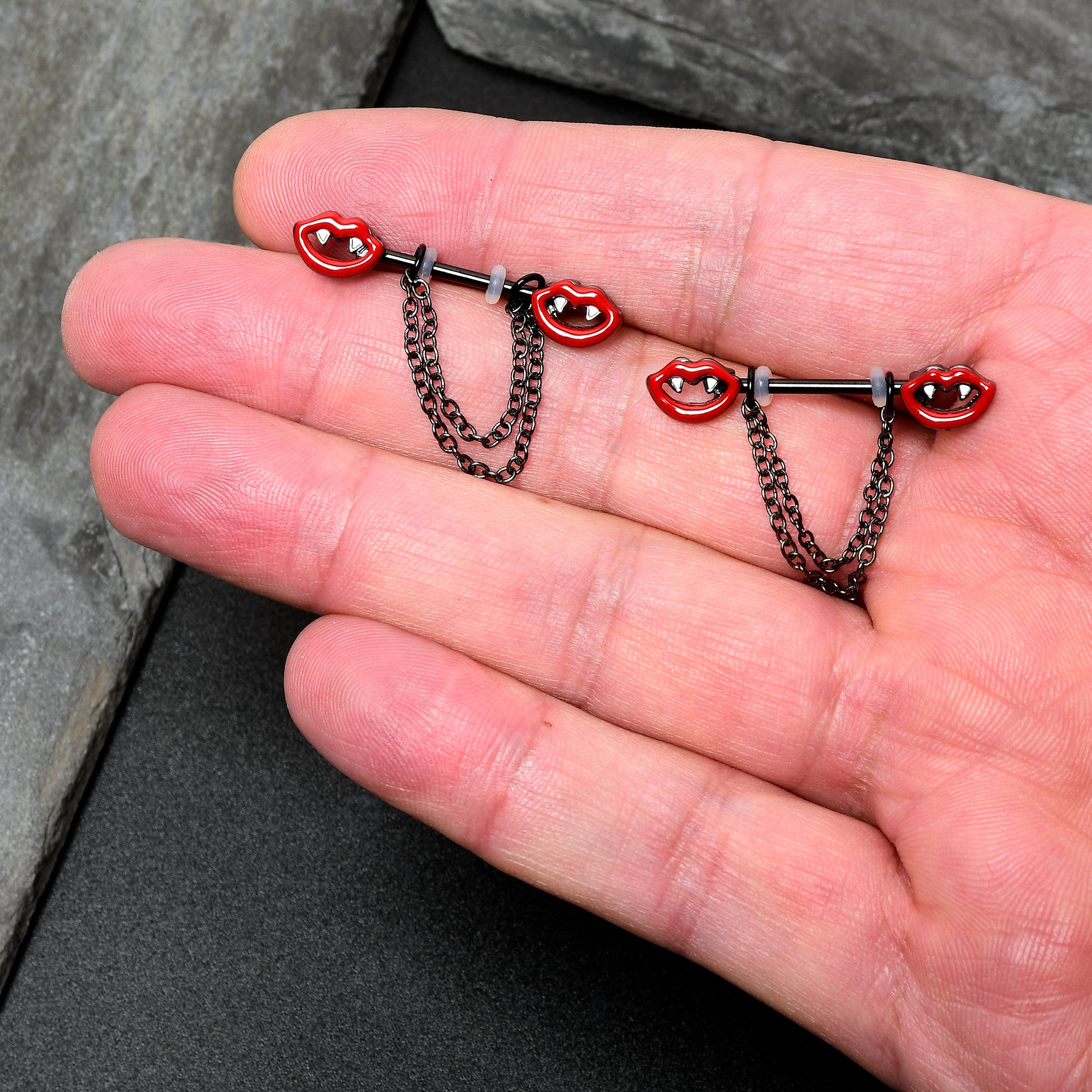 BodyCandy 14G 11/16 Black Vampire Fangs Chain Dangle Nipple Ring Set — in-use photo