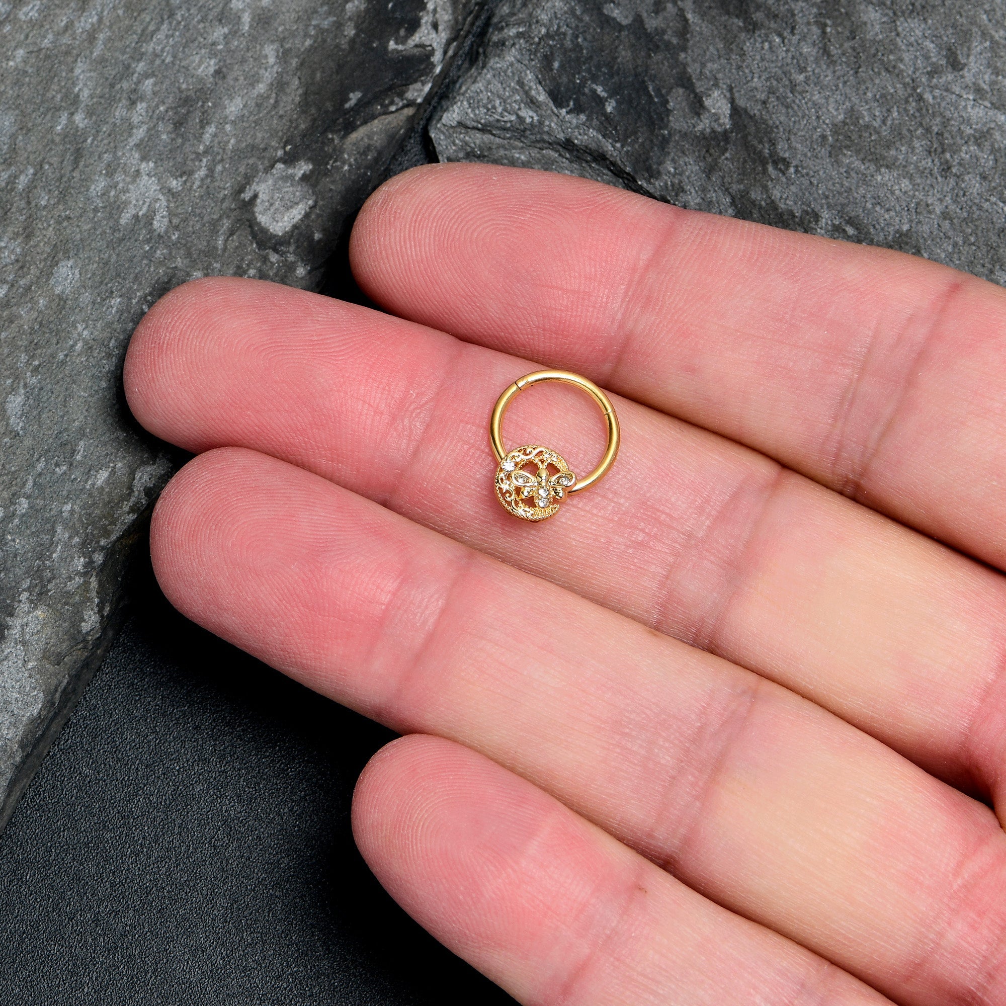 BodyCandy 16G 3/8 Clear Gem Gold Tone Lunar Dragonfly Hinged Segment Ring — lifestyle context