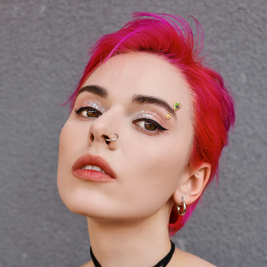 BodyCandy 16G 5/16 Blue Gem Gold Tone Butterfly Colors Curved Eyebrow Ring — lifestyle context