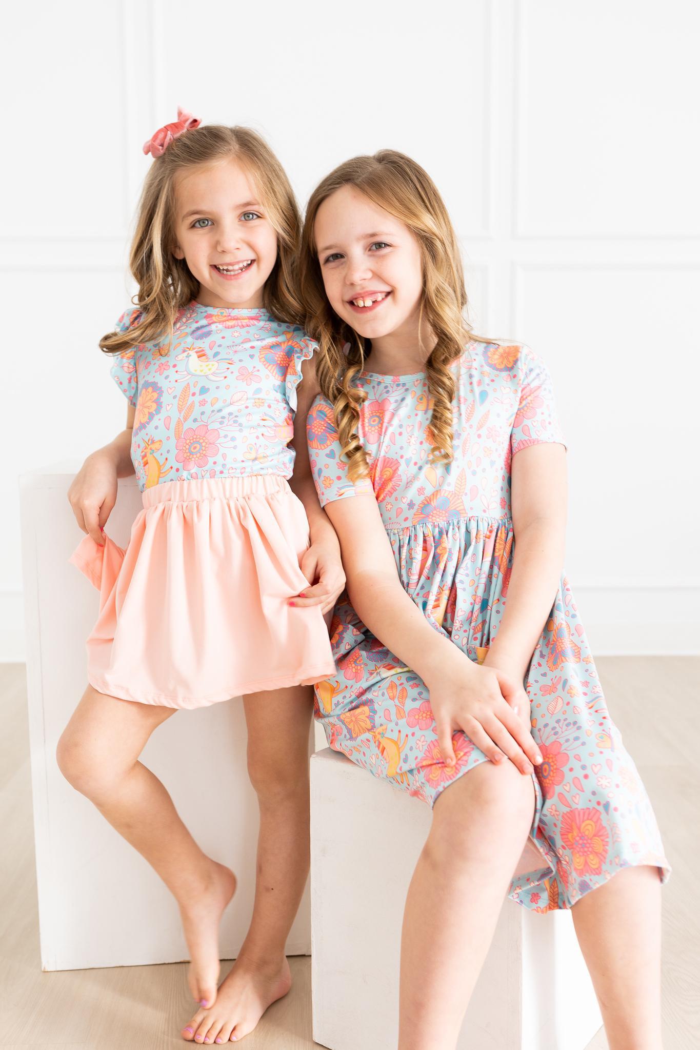 Mila & Rose ® SALE Blue Retro Unicorns S/S Ruffle Tee — lifestyle context