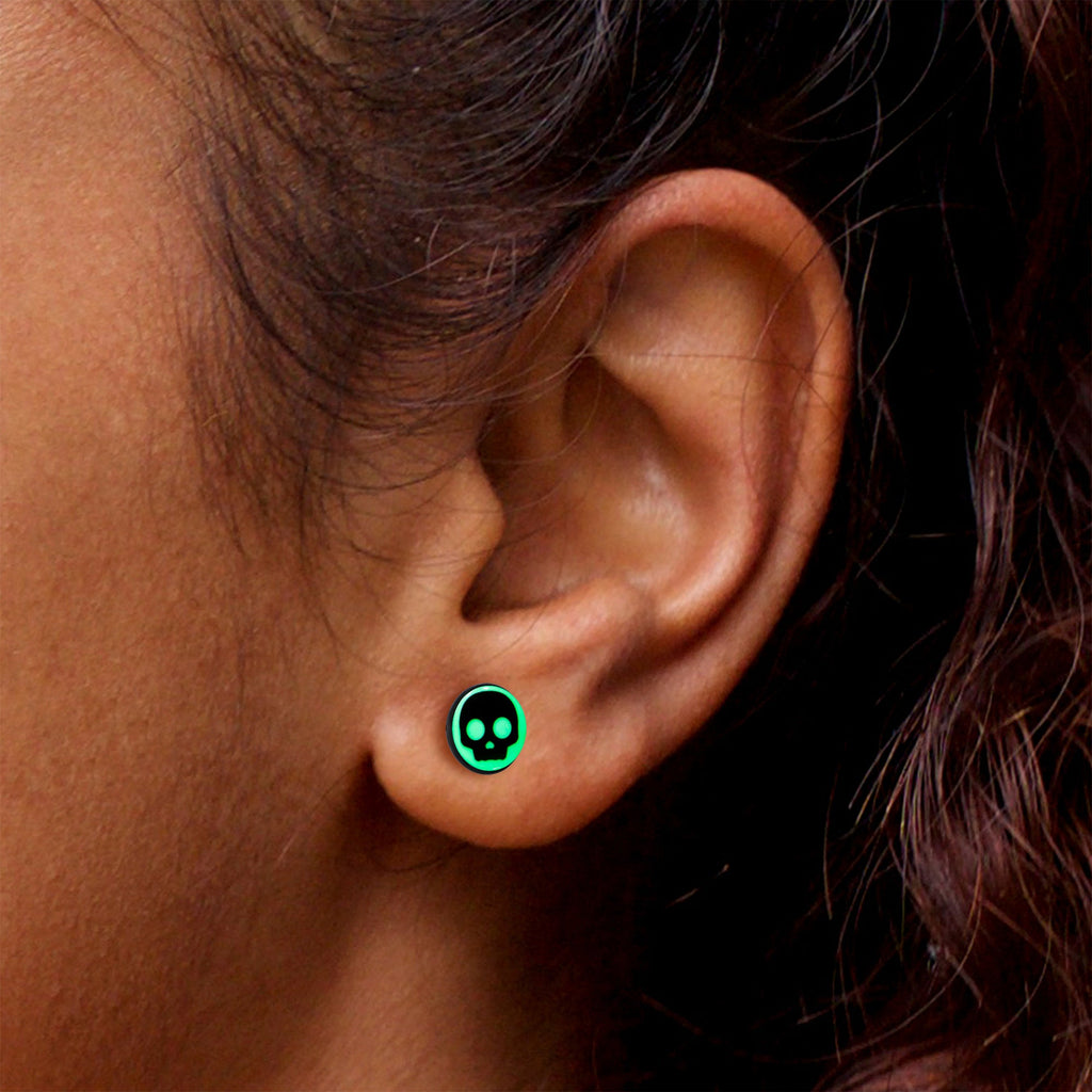 BodyCandy Simple Skull Glow in the Dark Stud Earrings by Onyx O — in-use photo