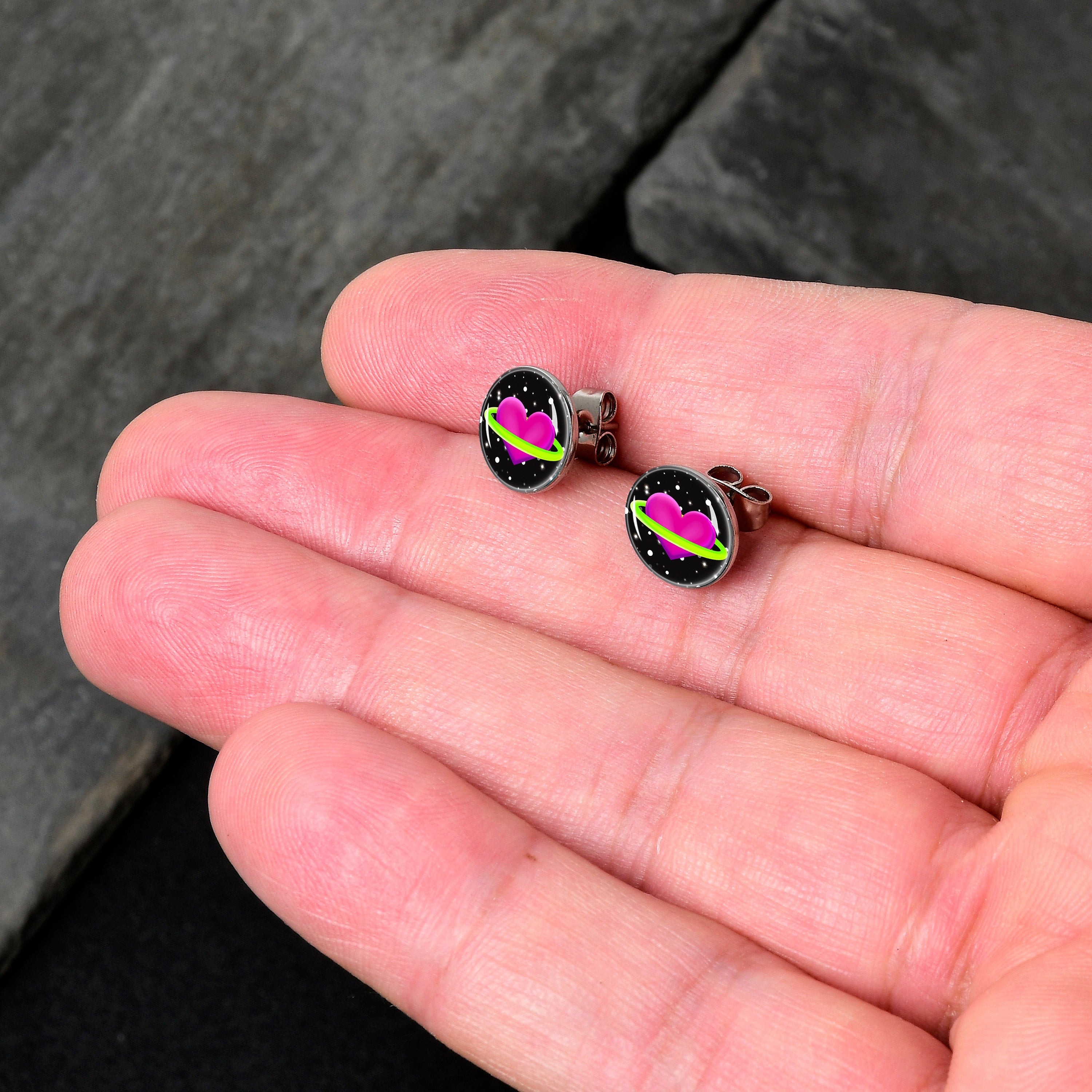 BodyCandy Heart Planet Stud Earrings by Onyx O — detail close-up
