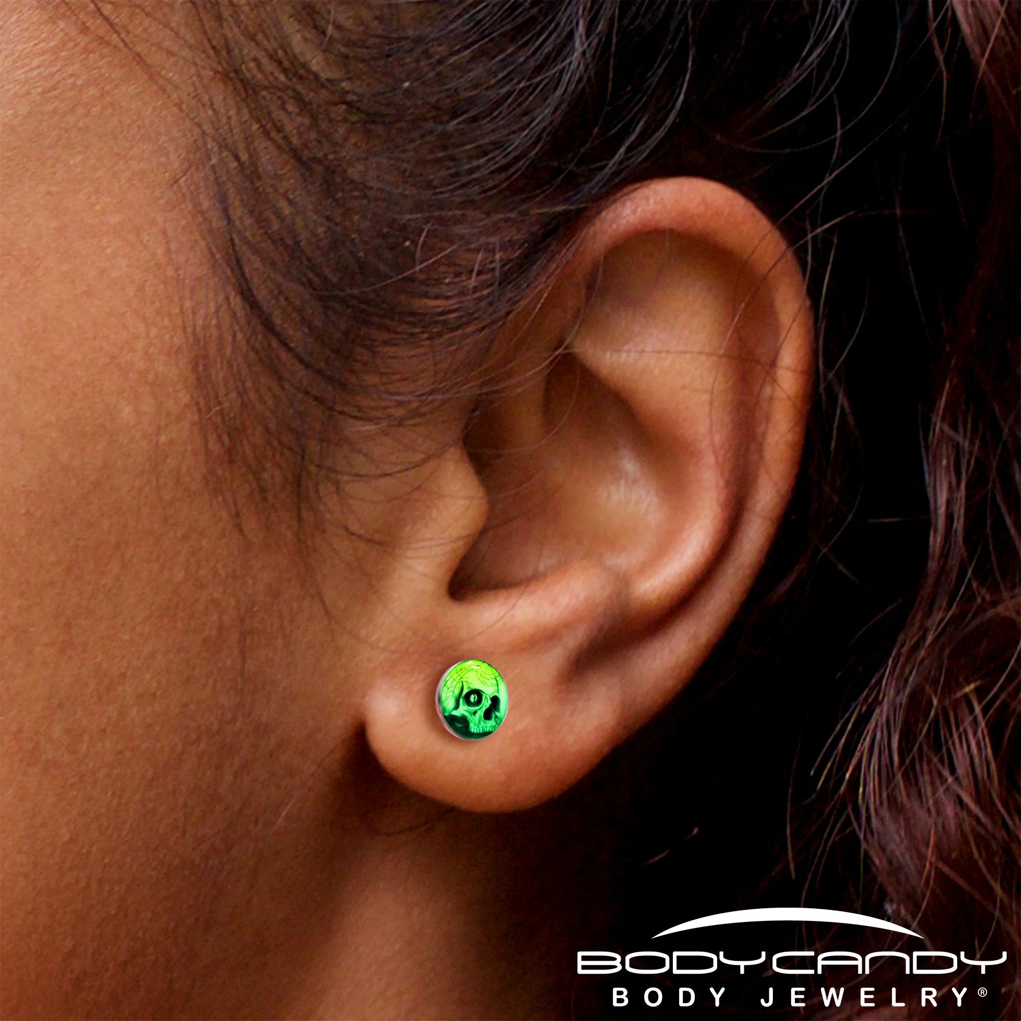 BodyCandy Webbed Skull Glow in the Dark Stud Earrings — side view