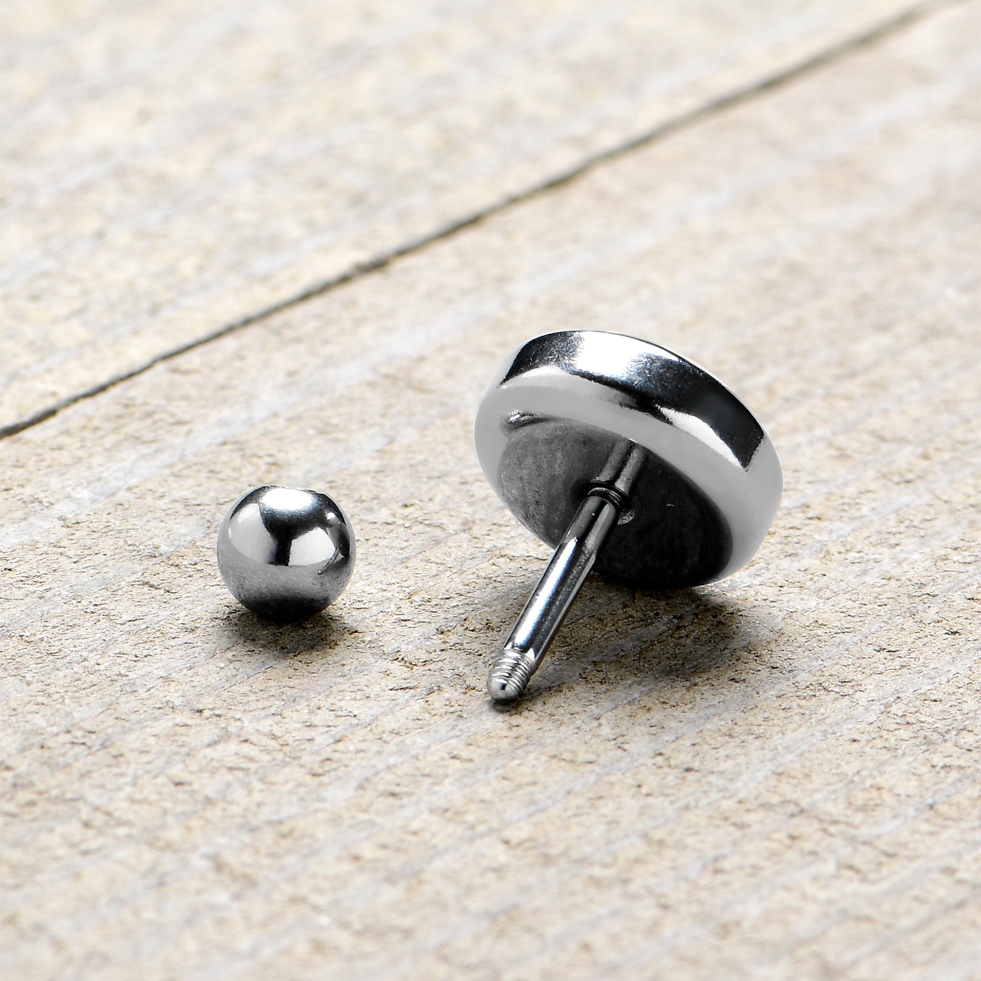 BodyCandy 16G 1/4 Vibe Cartilage Tragus Earring by Onyx O — in-use photo