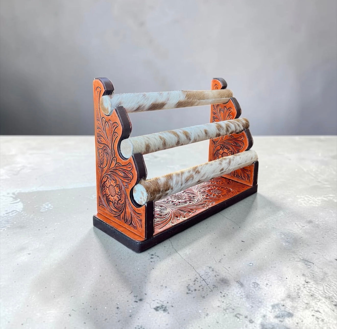 Tooled Leather and cowhide bracelet display