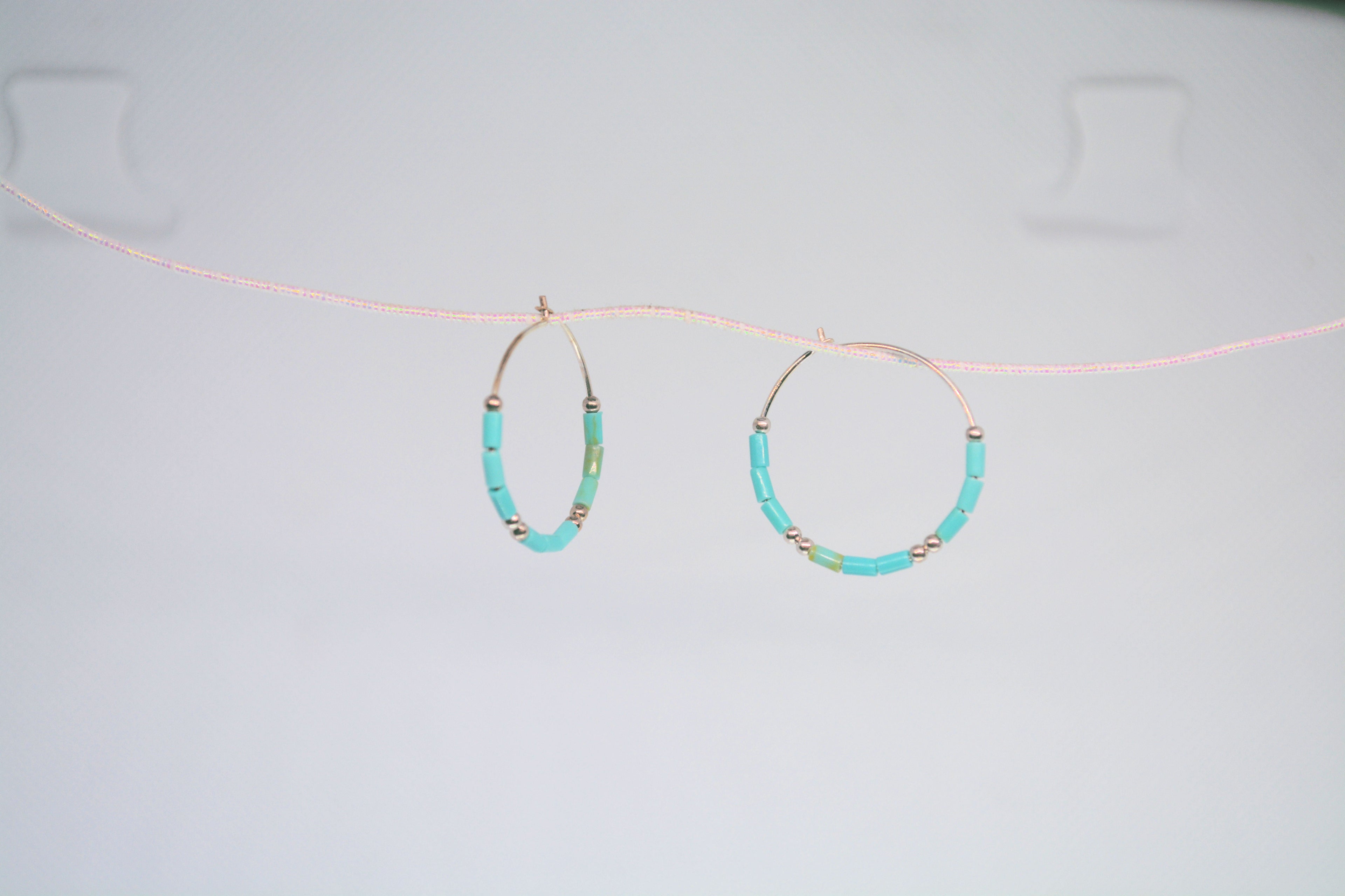 Just Neat Stuff Turquoise hoop earrings — back view