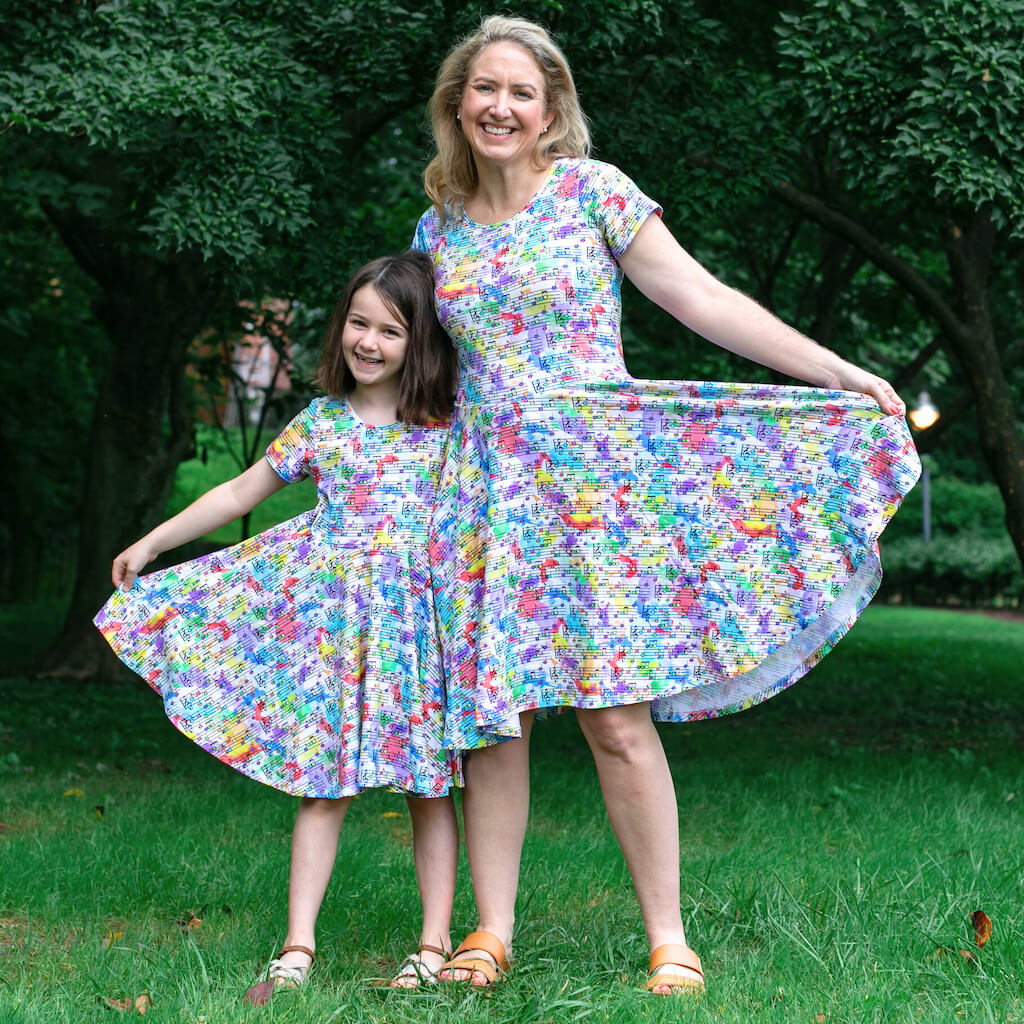 Princess Awesome & Boy Wonder "Staff Meeting" Rainbow Music Notes Super Twirler Dress with Pockets — back view