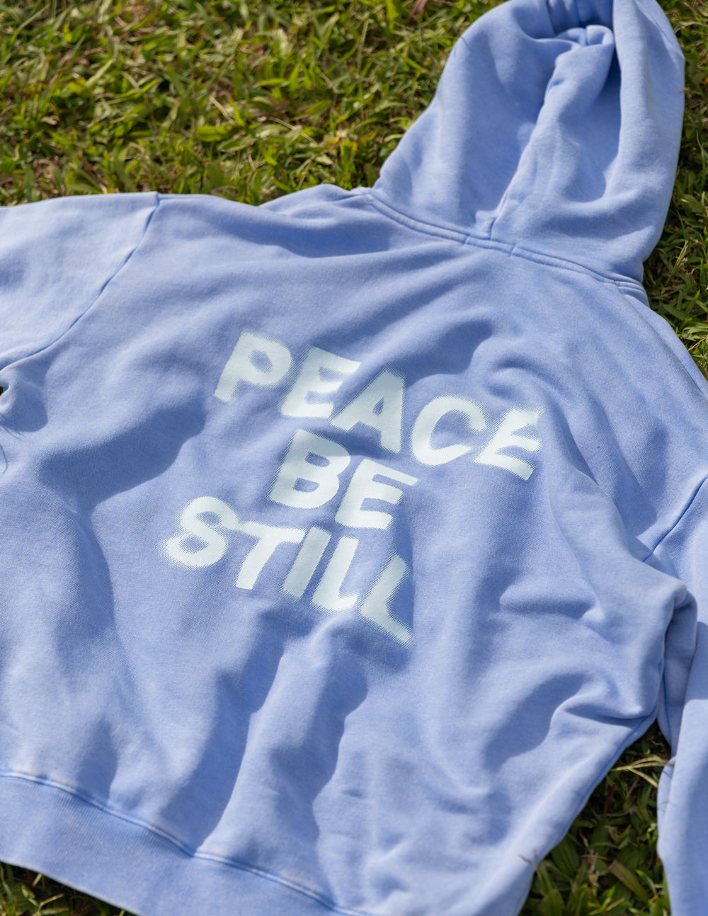Elevated Faith Peace Be Still Unisex Hoodie — side view