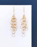 PARKEN JEWELRY Pearl Gold Chain Loop Earrings — lifestyle context