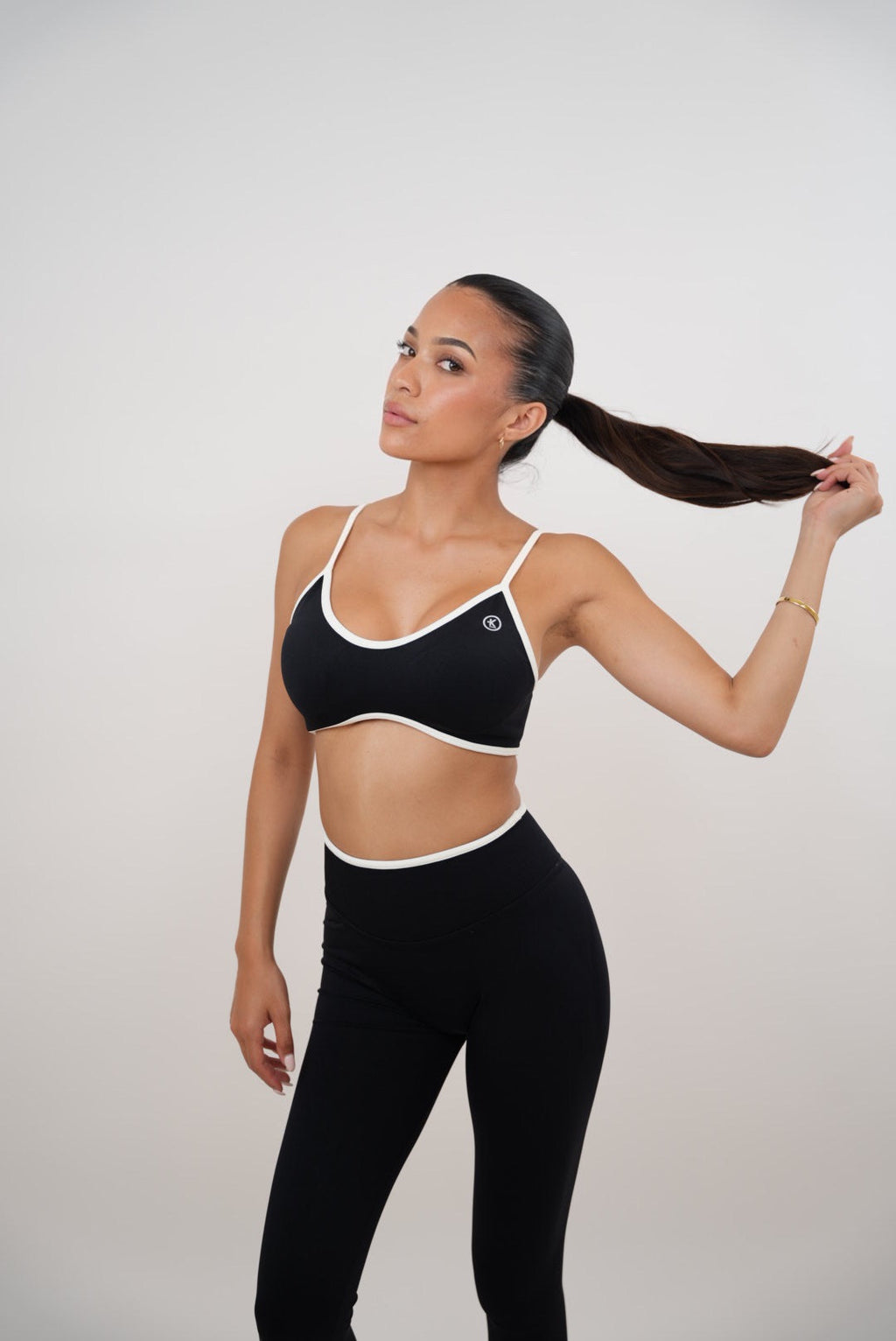 KIMITH BRAND Passion is Power Black Sports Bra — back view