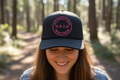 Tristan’s Treehouse Love is a Universal Language – Trucker Hat — main product shot