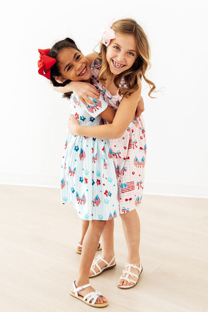Mila & Rose ® Fancy Flags Ruffle Cross Back Dress — lifestyle context