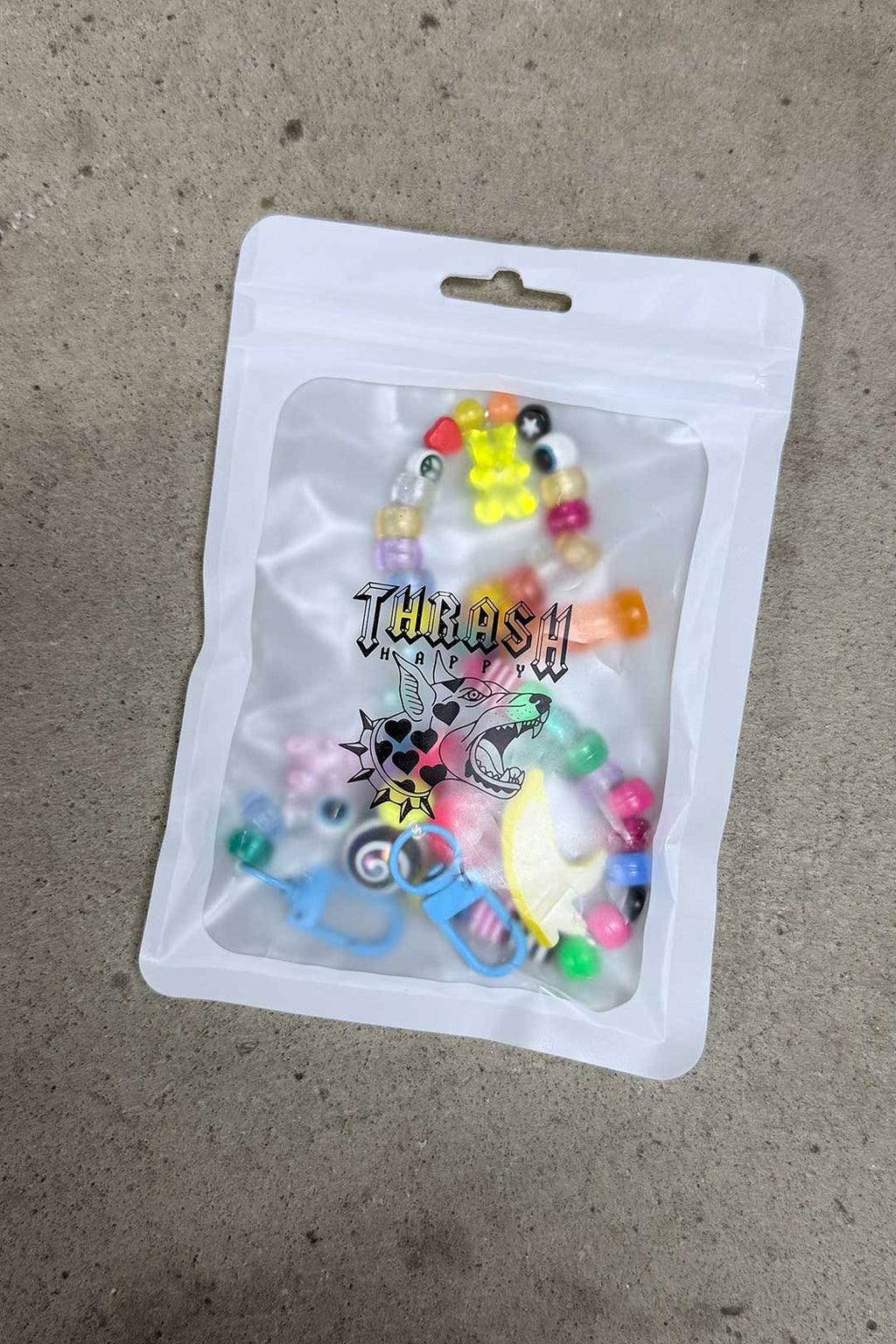 Thrash Happy Dummy Gummy Purse Charm — detail close-up