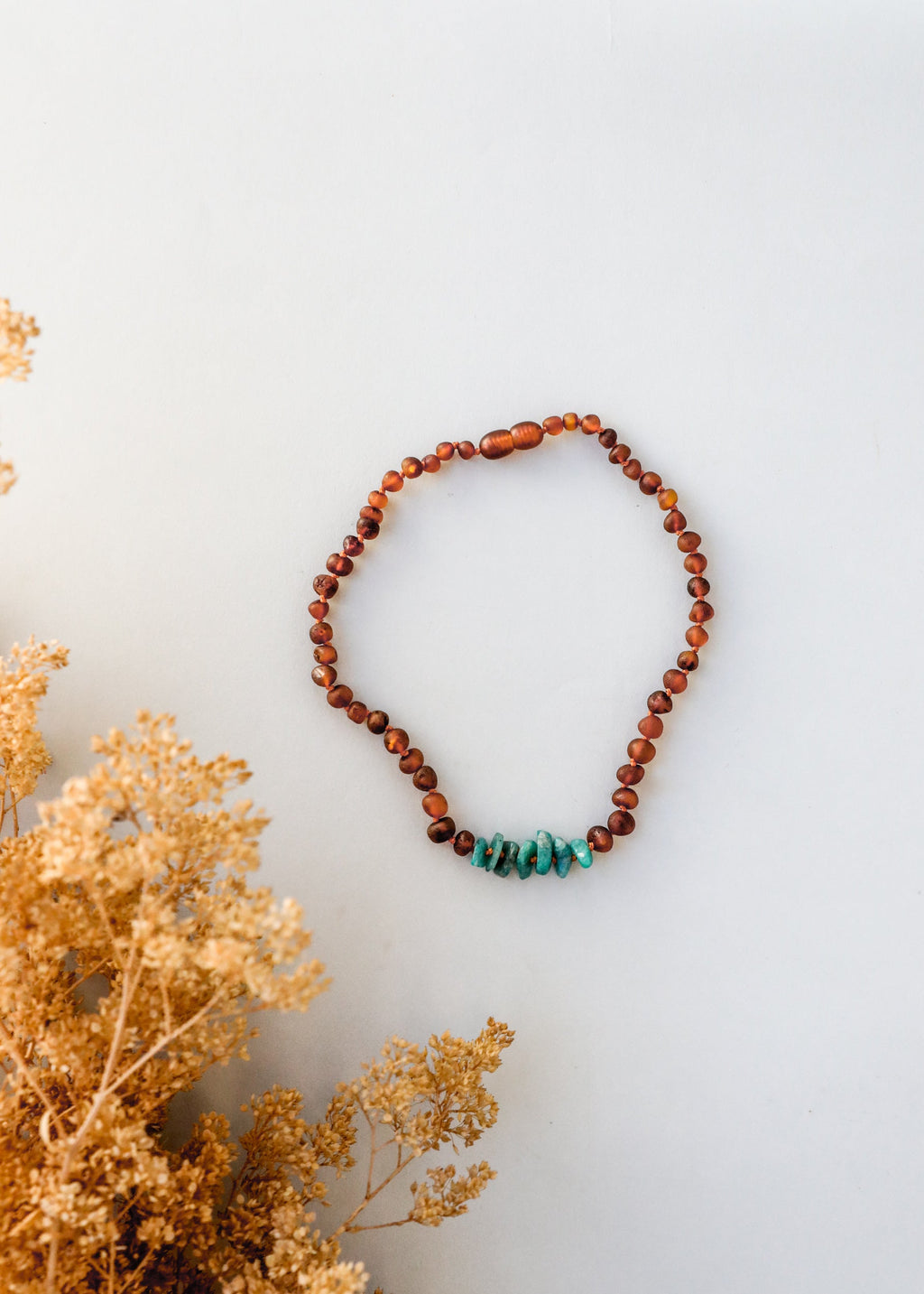 CanyonLeaf Raw Cognac Baltic Amber + Raw Amazonite || Necklace — CanyonLeaf branding close-up