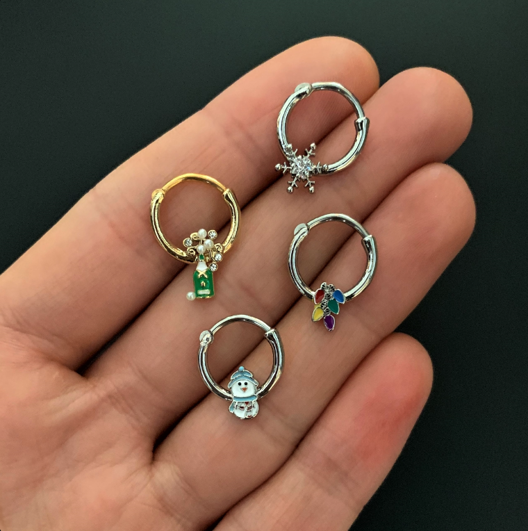 BodyCandy 16G 3/8 Clear Gem Green Champagne Bottle Holiday Septum Clicker — lifestyle context